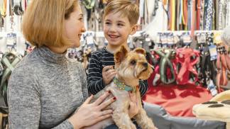 cute-little-dog-with-owners-pet-shop