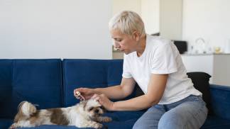 side-view-woman-using-dog-serum