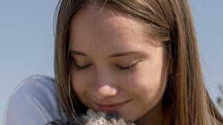 close-up-girl-hugging-cute-dog