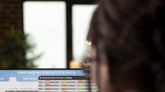 closeup-freelancer-comparing-business-data